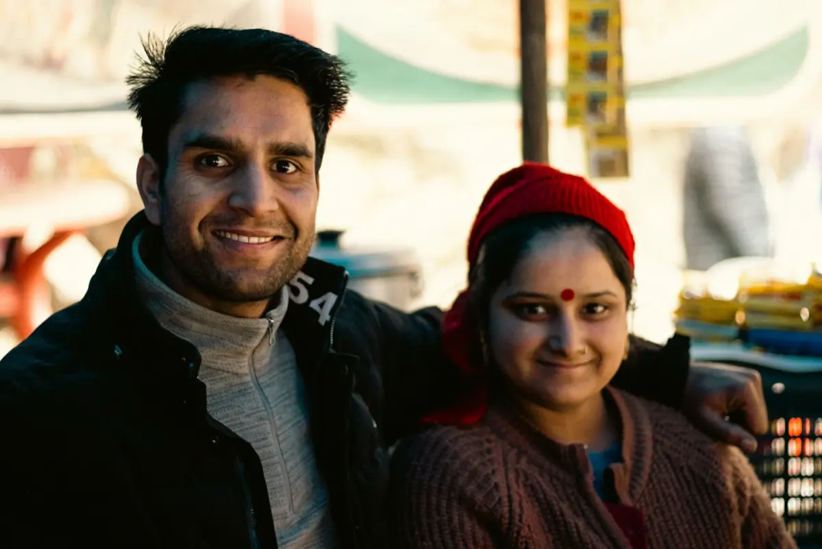 A son with his mother, both smiling