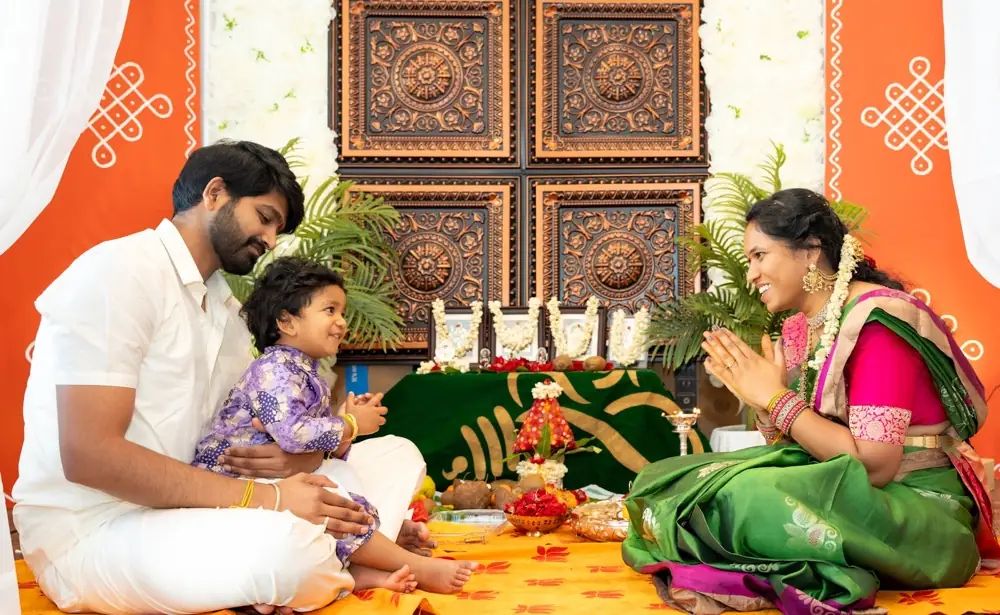 A family together on the floor at a festival