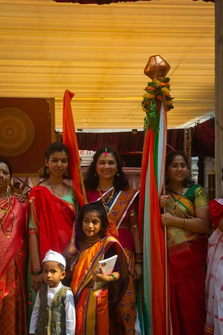 A family together at a celebration, in traditional dress